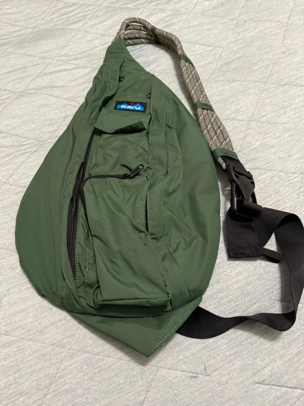 KAVU Rope Sling crossbody bag in a solid green colorway